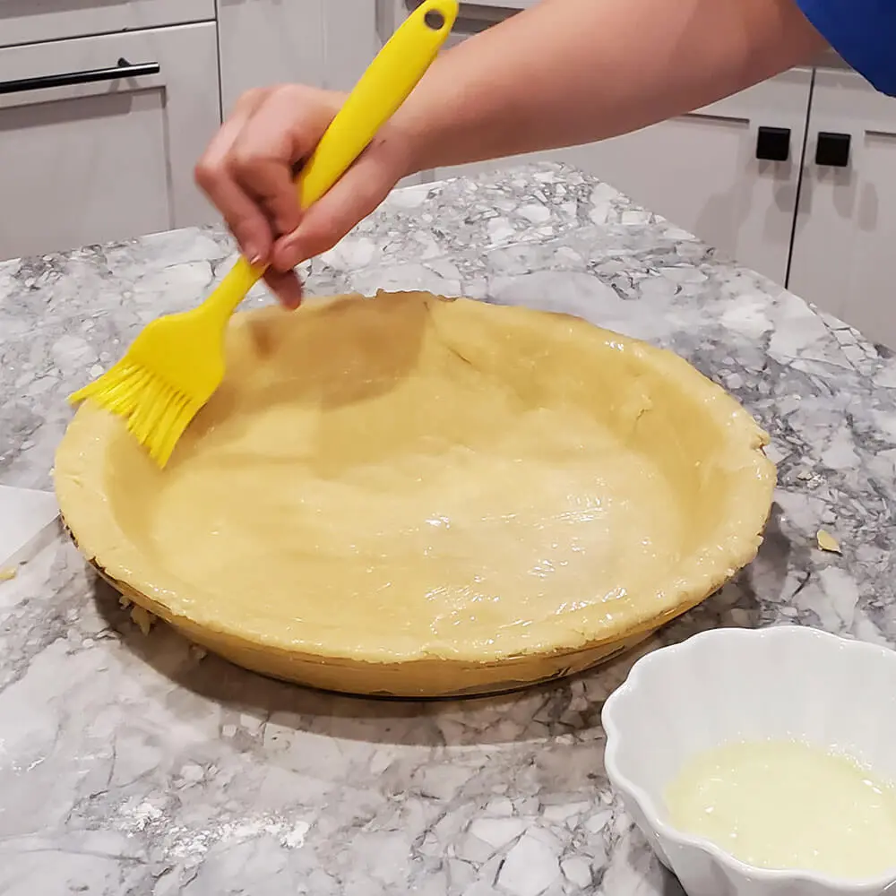 Brushing the pie crust